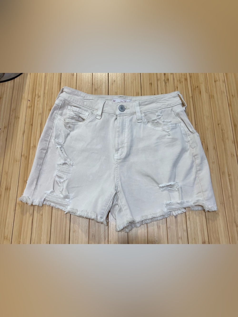So high rise distressed denim shorts. Off white. Size 9/29.